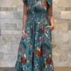 Robe Longue Mira - aux manches courtes smockée. Couleur bleu
