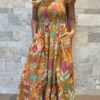 Robe Longue Mira - aux manches courtes smockée. Couleur jaune moutarde